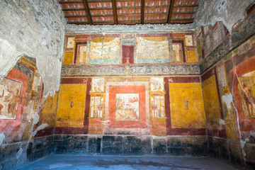 Walking around the ruins and the empty streets of the ancient antique site of Pompeii destroyed by...