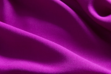 Fototapeta na wymiar lilac purple abstract background from a fabric with selective focus