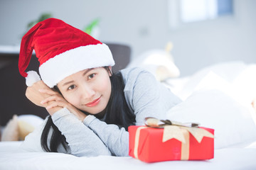 Portrait of young beautiful asian woman with christmas present boxes