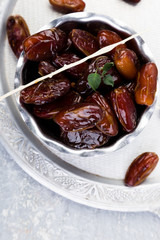 Dry fruit dates on silver tray. Copy space. Top view.