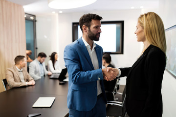 Portrait of business couple in conference room