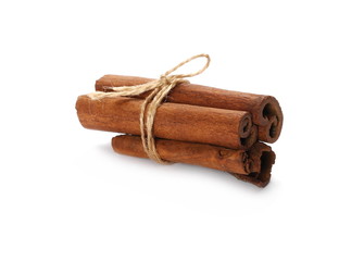 Cinnamon sticks tied together with string, spice isolated on white background