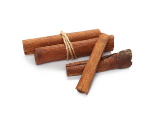 Cinnamon sticks tied together with string, spice isolated on white background