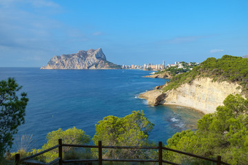 Obraz premium Calpe Rock seen from the Costa Blanca coastline between Calpe and Moraira, Spain.