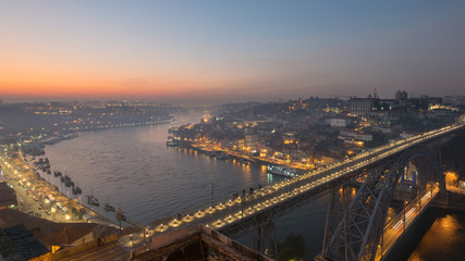 Fototapeta na wymiar The oldtown skyline at Sunset from Dom Luis Bridge, Douro River, Porto, Portugal, Iberian Peninsula, Europe