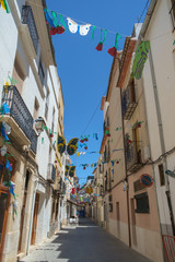 Fototapeta premium Benissa, Costa Blanca, a typical narrow town centre street, Spain.