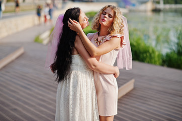 Naklejka premium Two future brides hugging at hen party.