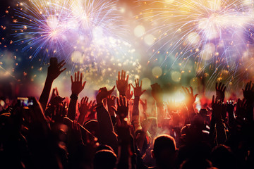 Fototapeta na wymiar cheering crowd watching fireworks - new year concept