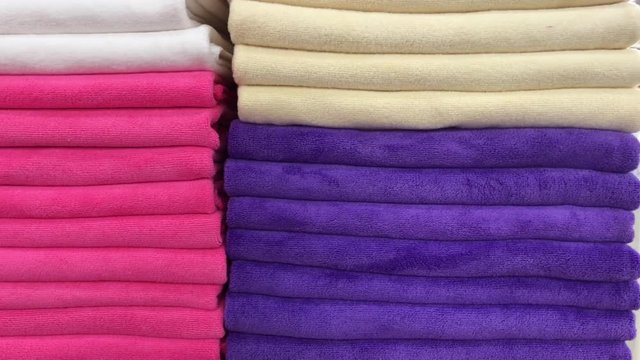 Close up of colorful towels in the store of shopping mall, Bali. Many towels.