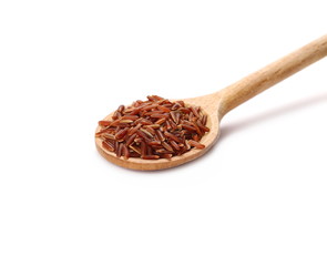Red wild rice pile in wooden spoon isolated on white background