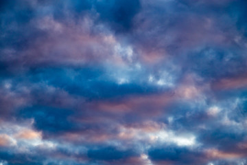 Naklejka na ściany i meble clouds in the sky at sunset as background