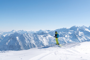 Freeride skier is enjoying the beautiful mountain landscape in the Sportgastein ski area in Austria.