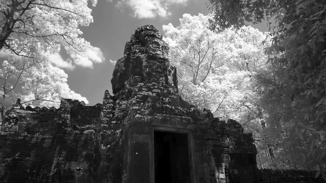 Steadicam motion toward the Banteay Kdei gate with camera pitching up as it moves forward.