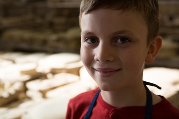 Smiling boy in pottery workshop