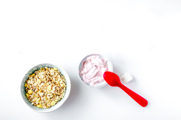 Fototapeta na wymiar concept kid breakfast with yogurt top view white background