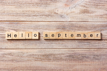 hello September word written on wood block. hello September text on table, concept © sosiukin