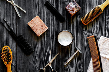 Tools for cutting beard barbershop top view on wooden background