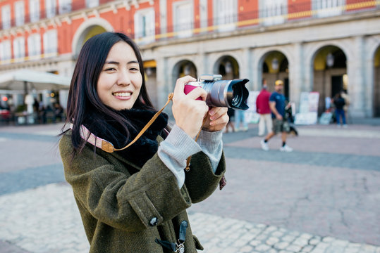 Woman tourist with camera