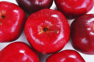 Top view center, red apple surrounded by apples  on white background
