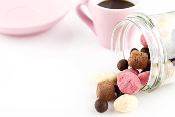 Valentines day background with handmade candies and pink cup of coffee