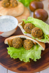 Falafel with lettuce and vegetables in pita bread.