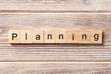planning word written on wood block. planning text on table, concept