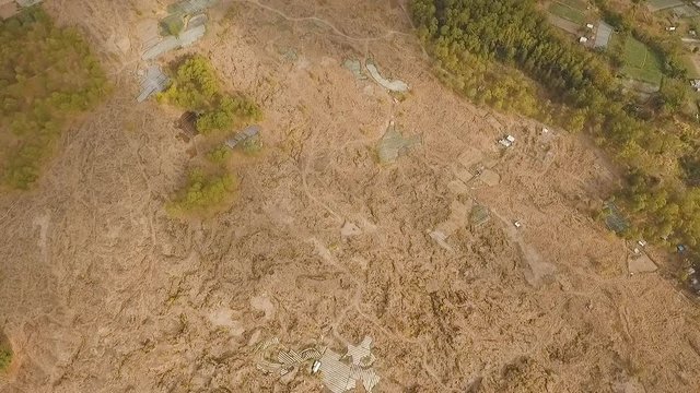 Volcano traces of lava on the ground, Volcanic relief. Aerial view of Mount Batur Volcano in Kintamani. Travel concept. Aerial footage.