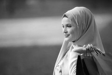 Muslim girl with shopping bags