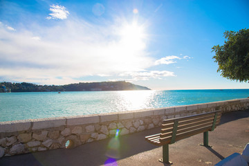 Morning over the sea. Cote d'Azur, turquoise water, sea, sun, sky, bench