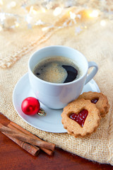 Christmas heart-shaped Cookies and coffee cup with decoration.