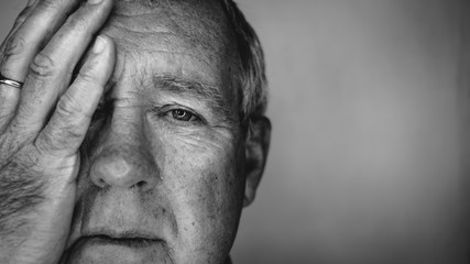 Close up face portrait Older depressed man