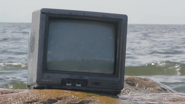 Telly on stone of sea. Paradox, joke
