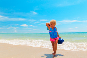 Fototapeta na wymiar little girl go swim at beach
