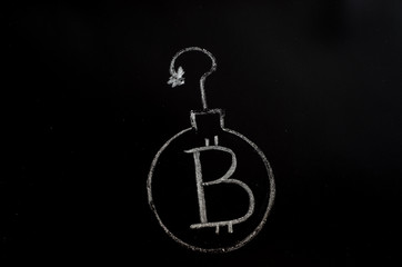 Bitcoin inscription with white chalk on a black board