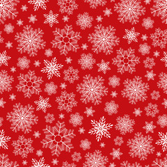 Christmas seamless pattern of snowflakes on red background. Vector.