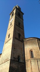 Fototapeta na wymiar Tower bell and apse detail of San Michele Vetere romanesque church in Cremona