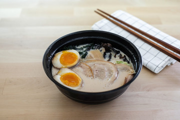 Traditional Japanese soup ramen with sliced pork and eggs