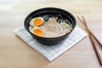Traditional Japanese soup ramen with sliced pork and eggs