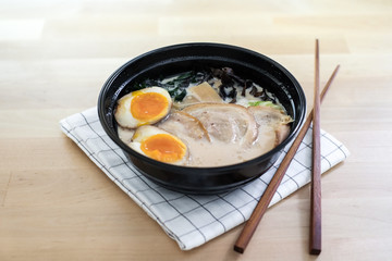 Traditional Japanese soup ramen with sliced pork and eggs