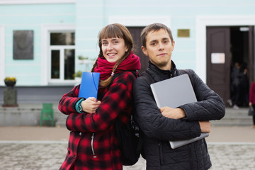 students concept - boy and girl invite you to study