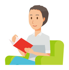 A man wearing a short sleeve shirt sits on a sofa and is reading books