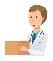 Fototapeta premium A young male doctor wearing a white suit has a cardboard box