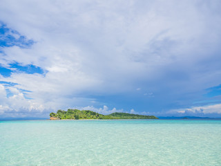 Landscape of clear blue sea and cloudy sky with island.