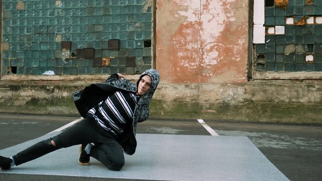 Hip-hop and breakdancing. Breakdancer dancing in the street. 4K