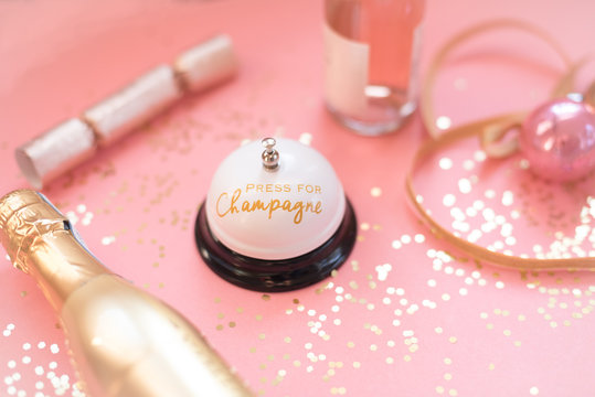 Pink and gold champagne flat lay with glitter