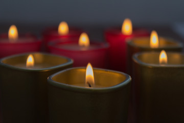 a lot of burning candles in twilight