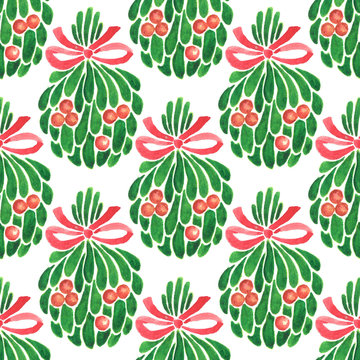 Seamless watercolor Christmas pattern. Hand painted mistletoe with holly berries and a red ribbon