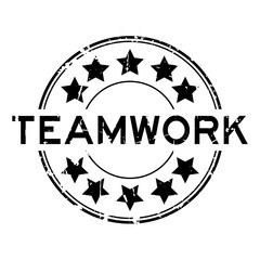 Grunge black teamwork word round rubber seal stamp on white background