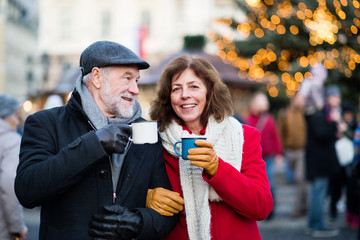 Senior couple on an outdoor Christmas market.