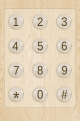 Telephone Keyboard on Light-colored Wood Texture